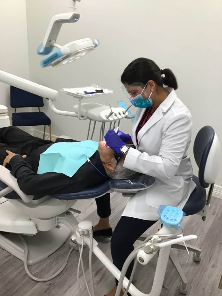 Texan Smile Dentist Sugar Land 77479 Dr. Xavier with patient