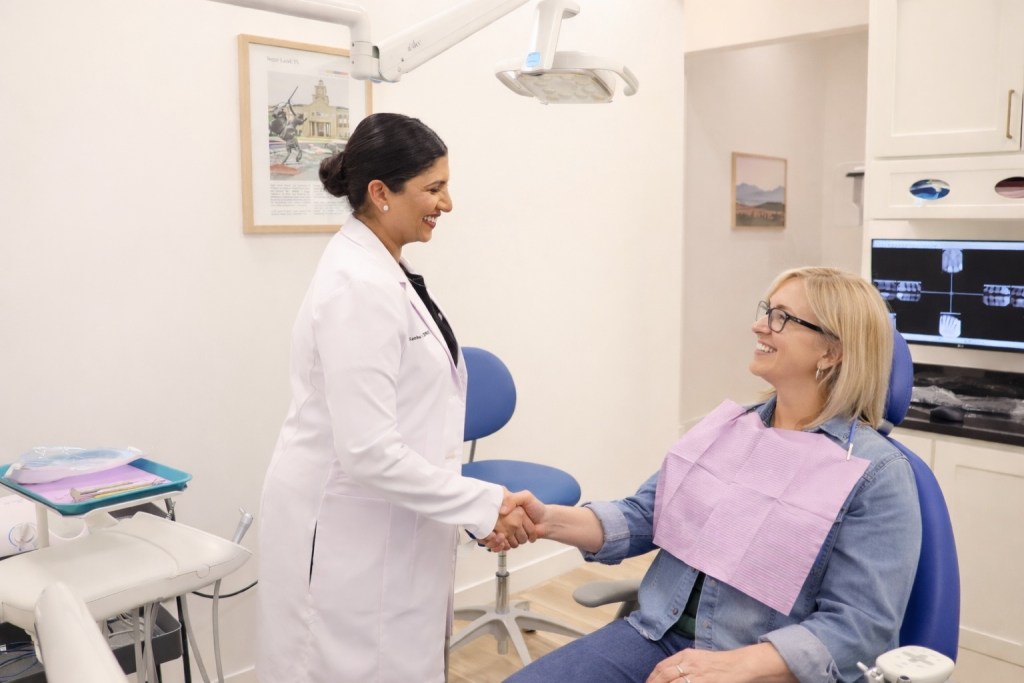 Dr Sneha Xavier greeting a patient at Texan Smile
