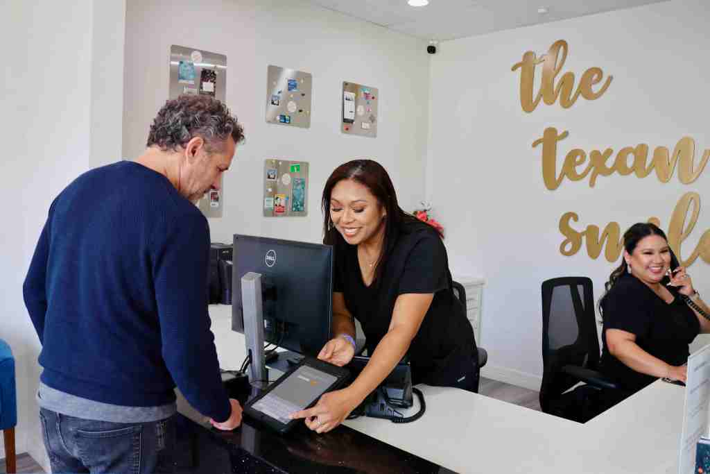 Texan Smile team helping patients with dental insurance in Sugar Land